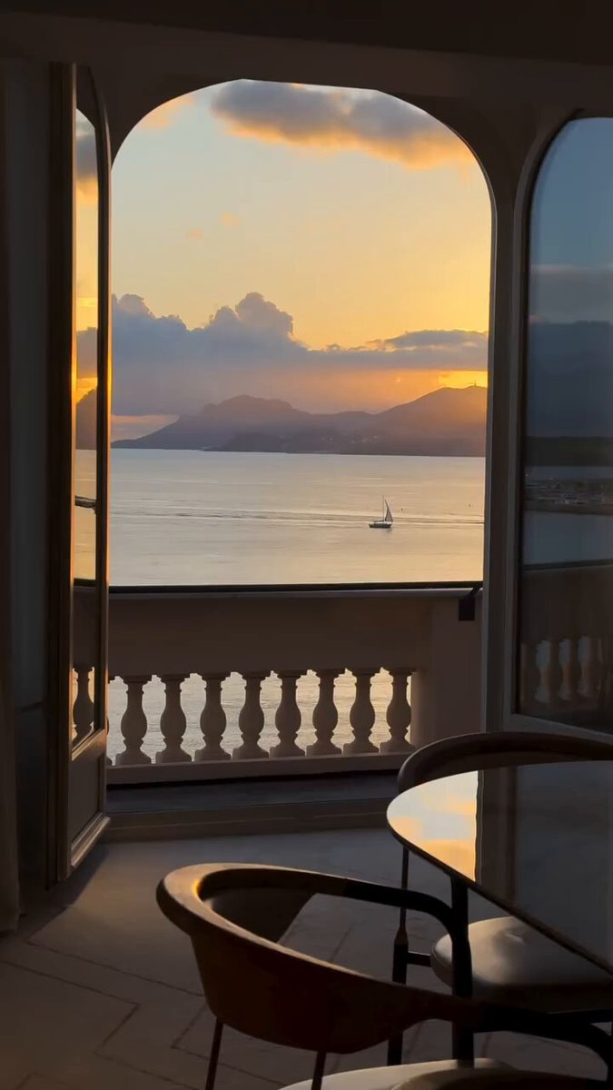 Sunset sailboat view from balcony