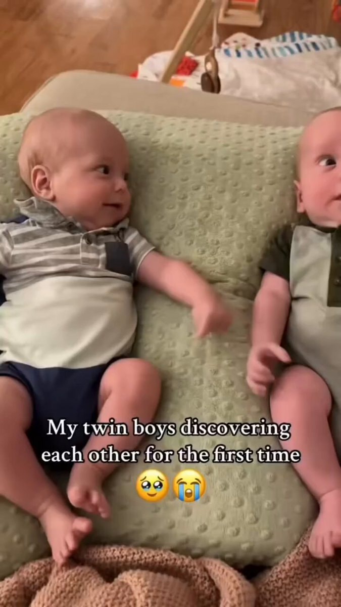 baby realizes he's not the only baby