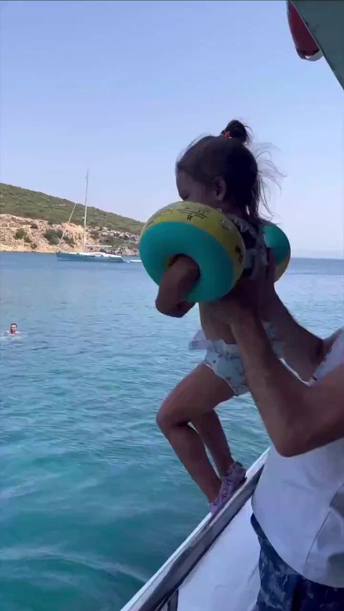 girl jumping off boat