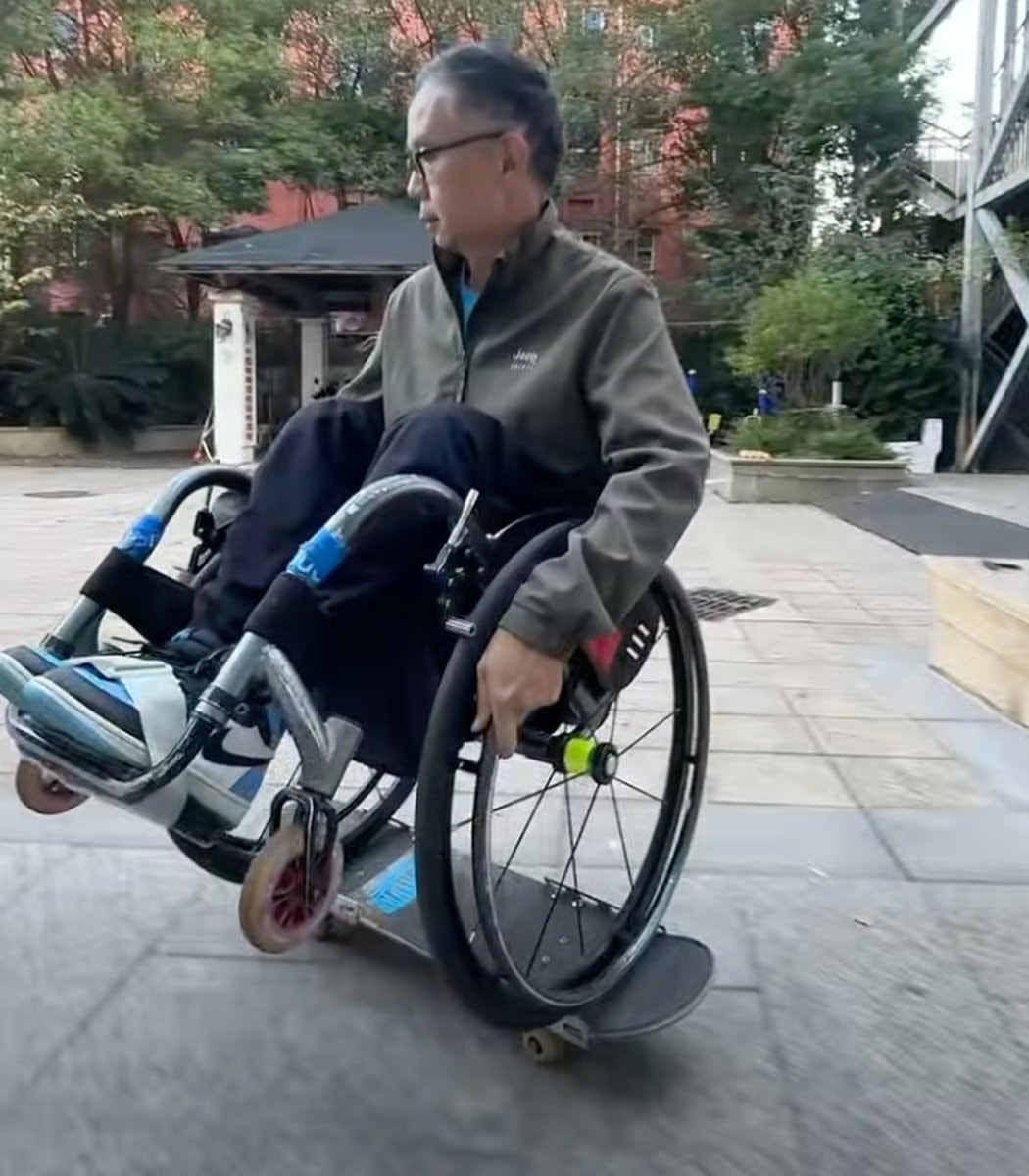 Xie Junwu wheelchair wheelie record