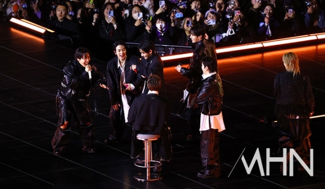 RM of BTS sitting on chair at concert (photo 2 of 2)