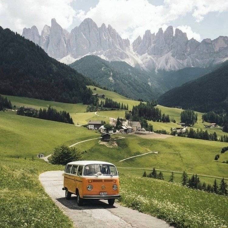 orange VW van in green hills (photo 1 of 4)