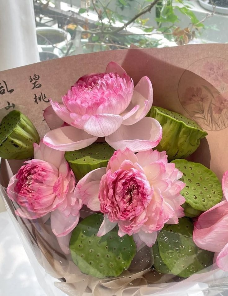 Pink Lotus Bouquet in Car (photo 4 of 4)