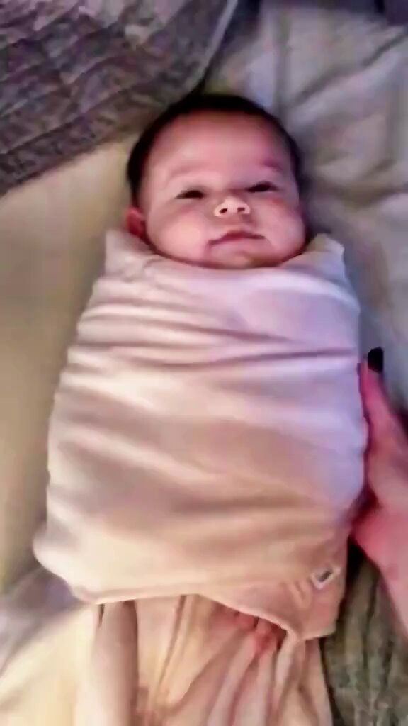 swaddled baby freedom