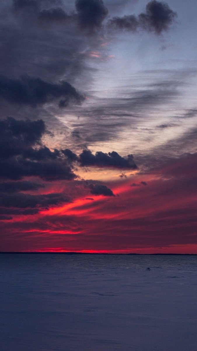 sunset over frozen water