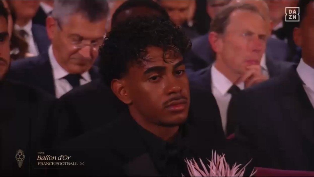 young man in black suit