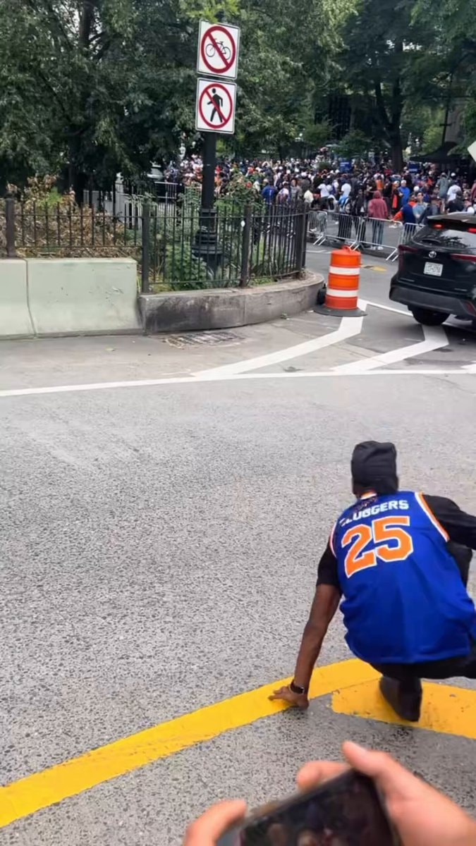 Jets fan on street SLUGGERS jersey