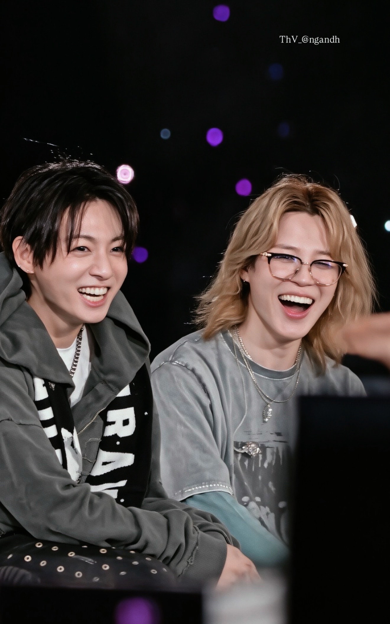 Jungkook and member laughing together (photo 2 of 4)