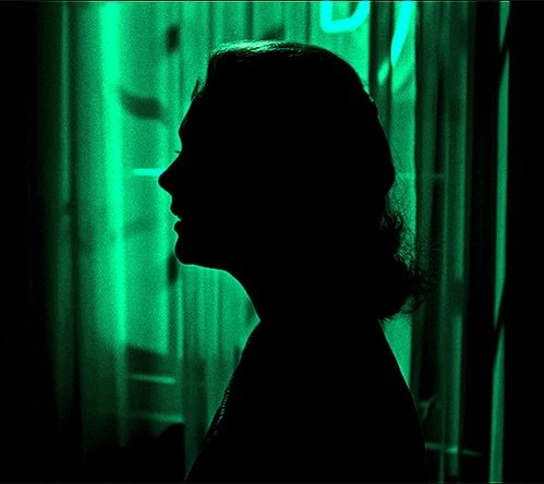 Hitchcock silhouette green background