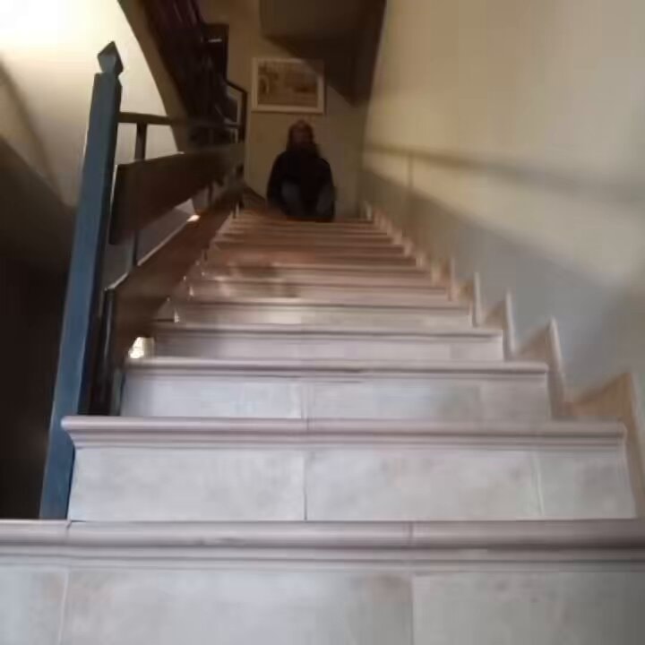 person sliding down staircase