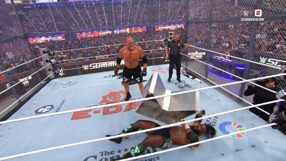 Brock Lesnar hits Oba Femi with steel steps at SummerSlam Brock Lesnar hits Oba Femi with steel steps at SummerSlam