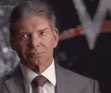 Vince McMahon looking to his left