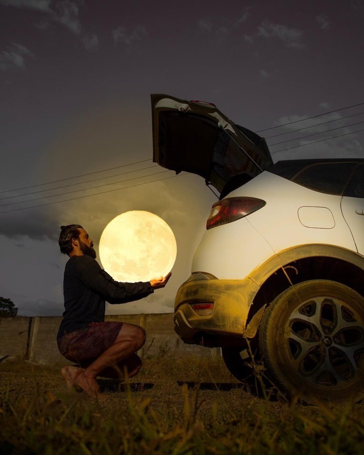 Man holding glowing moon orb