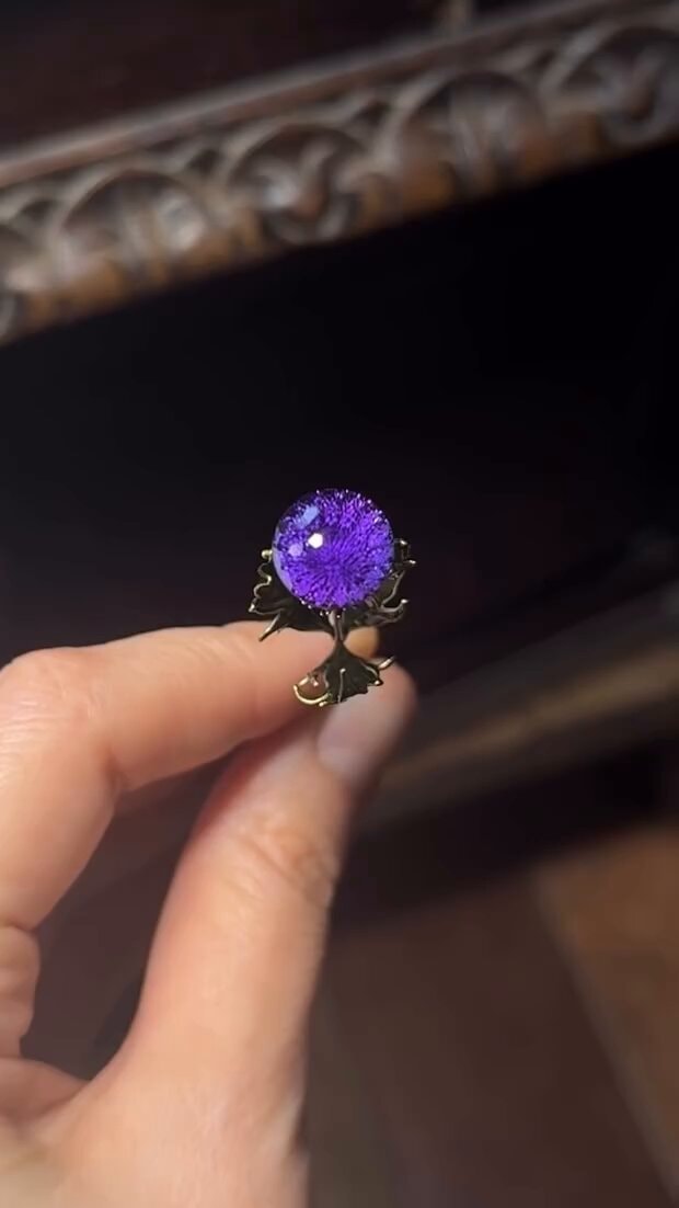 Thistle brooch with special cut amethyst