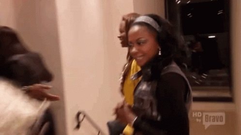 women smiling in hallway