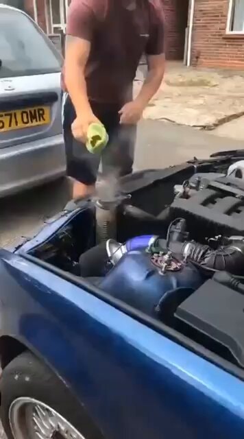 Blue car engine repair steam