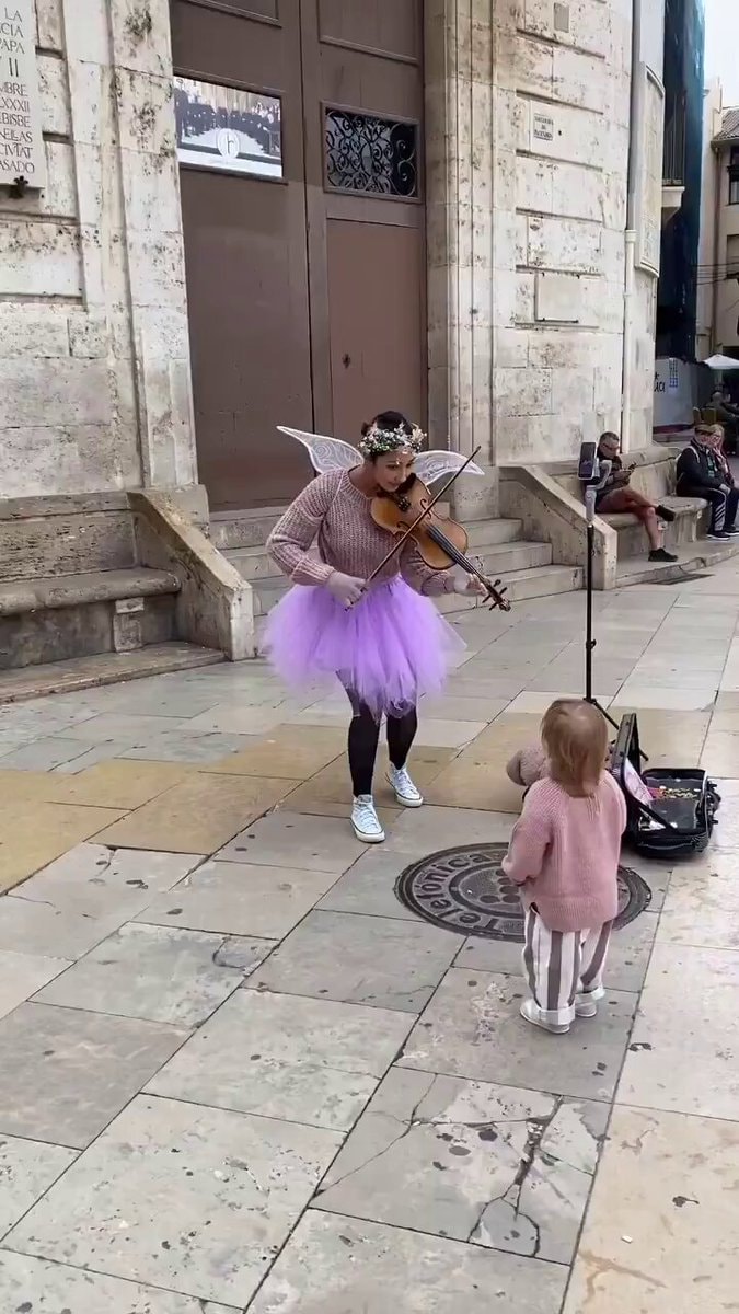 Fairy violinist plays for a child