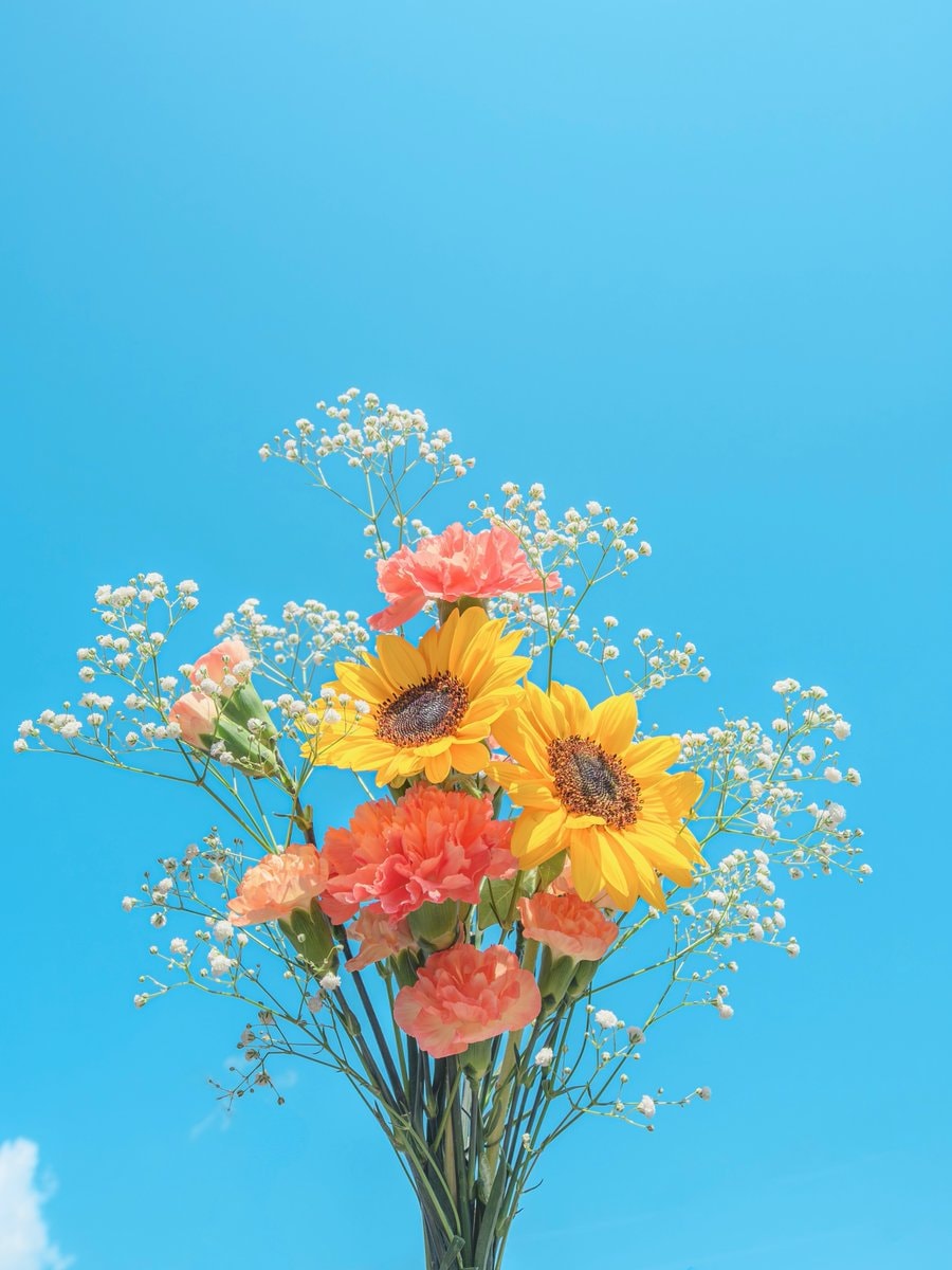 bouquet of flowers against blue sky (photo 2 of 4)