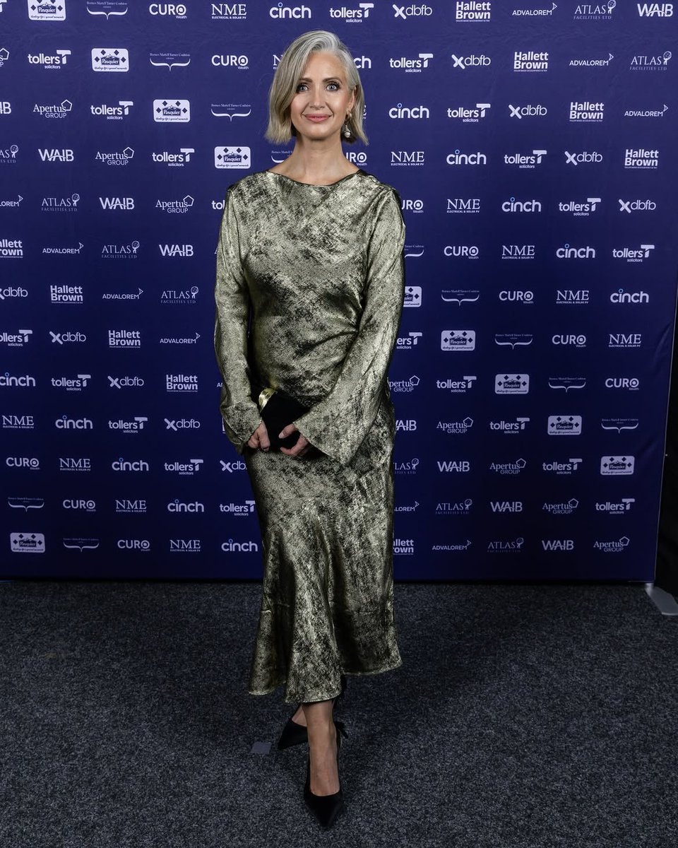 Hayley McQueen in gold dress