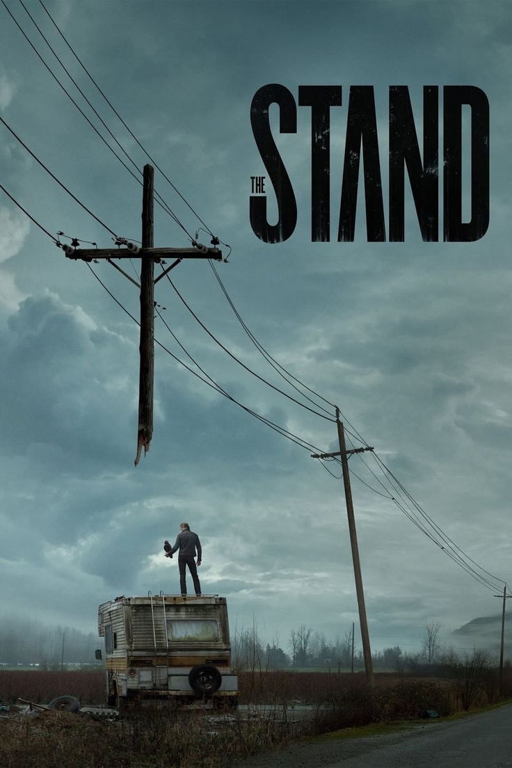 man standing on a dilapidated RV