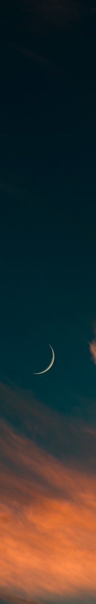 crescent moon in dark sky