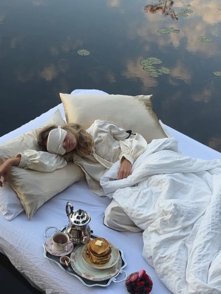 woman stretching on floating mattress (photo 3 of 4)