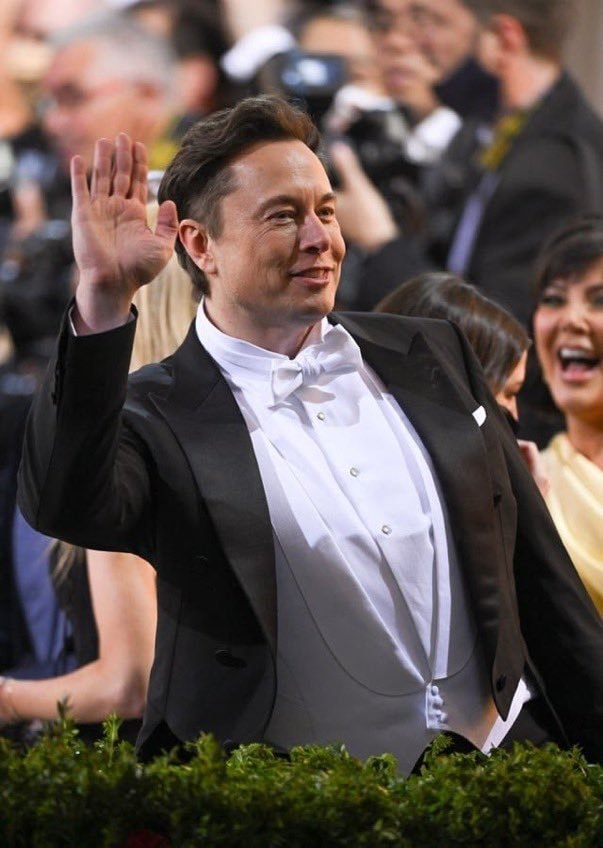 Elon Musk tuxedo wave
