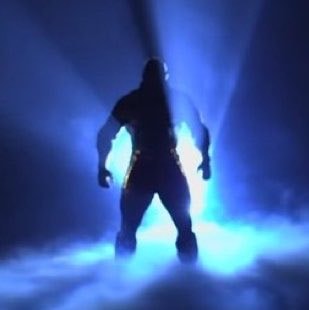 Wrestler emerging from blue smoke (photo 2 of 2)
