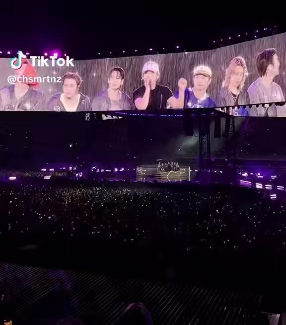 BTS performing in the pouring rain