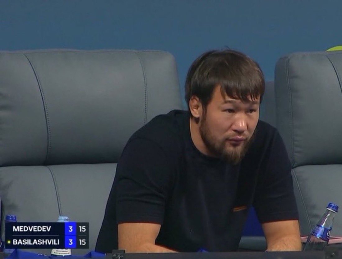 man sitting in stadium seat