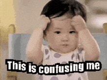Confused kid pulling hair GIF