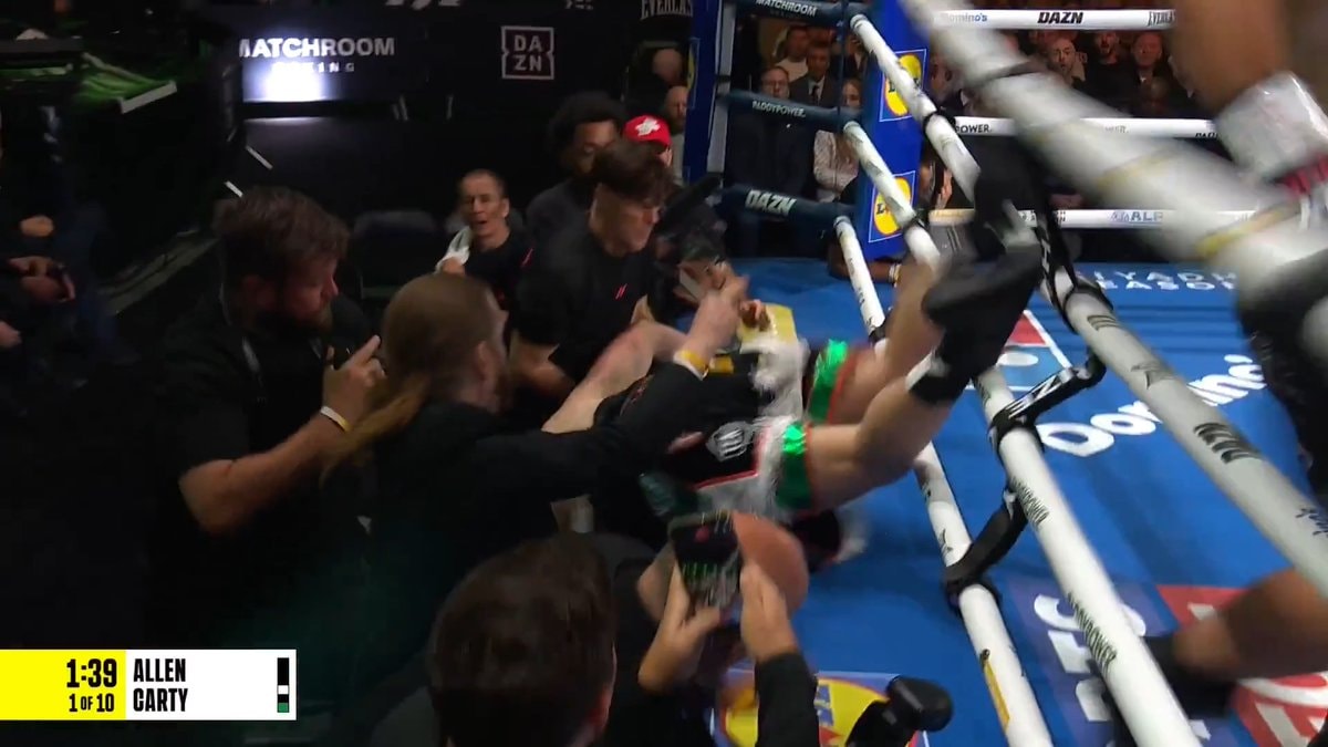 large fighter falls out of ring
