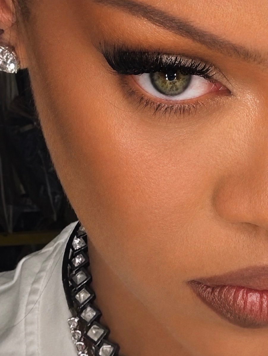 Woman with green eyes and berry lips