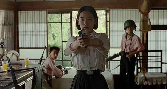 woman aiming gun gif