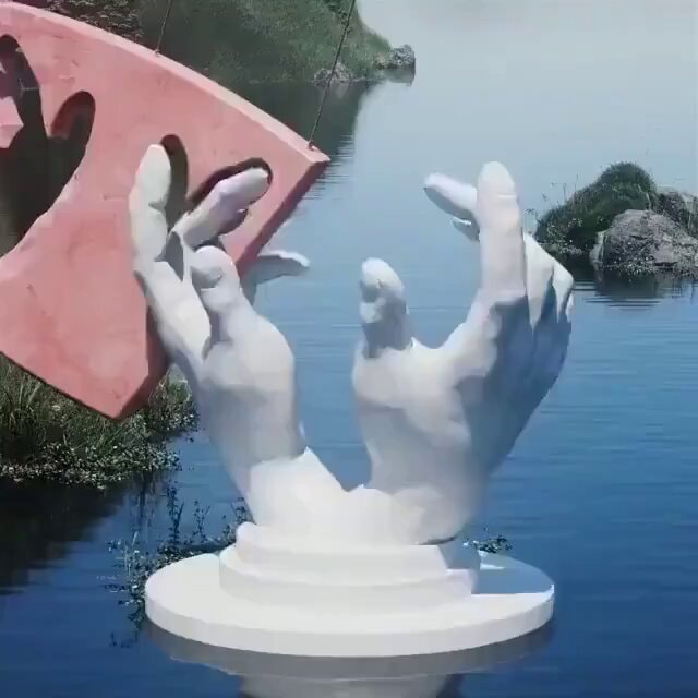 White hands reaching for pink heart sculpture
