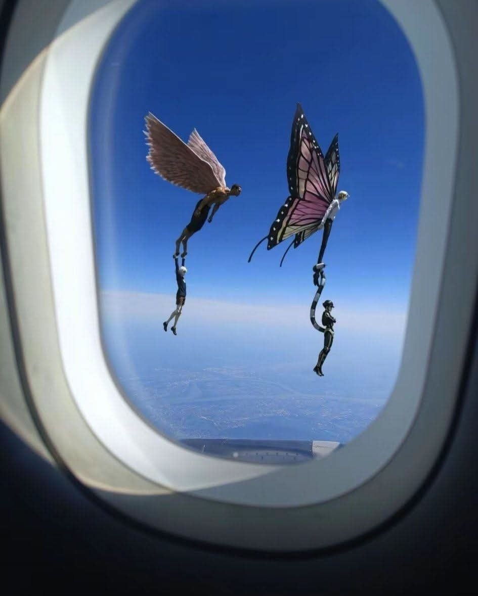Surreal winged figures falling through sky