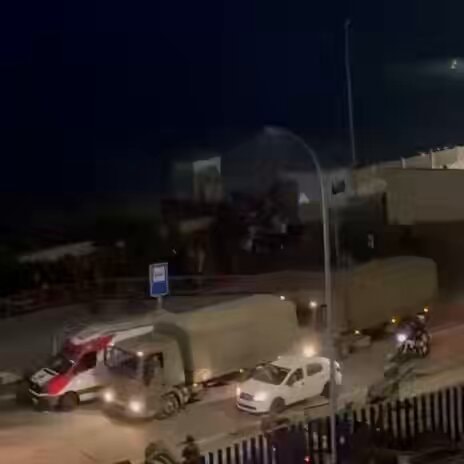 Spain migrant convoy at night
