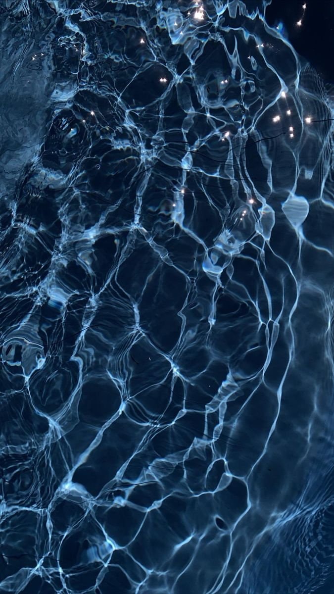 Dark blue water light reflections