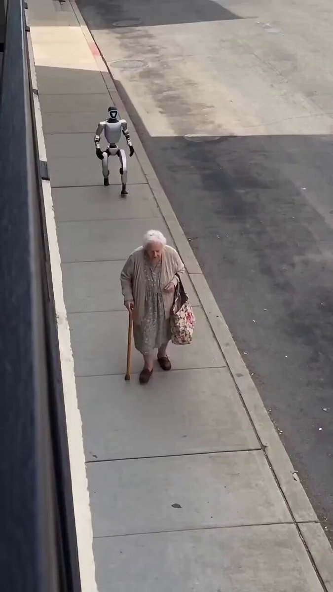 Elderly woman teaches robot etiquette