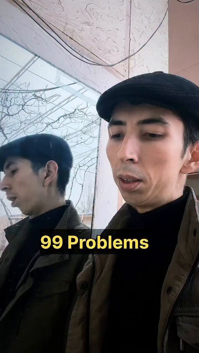 man in black cap and dark jacket