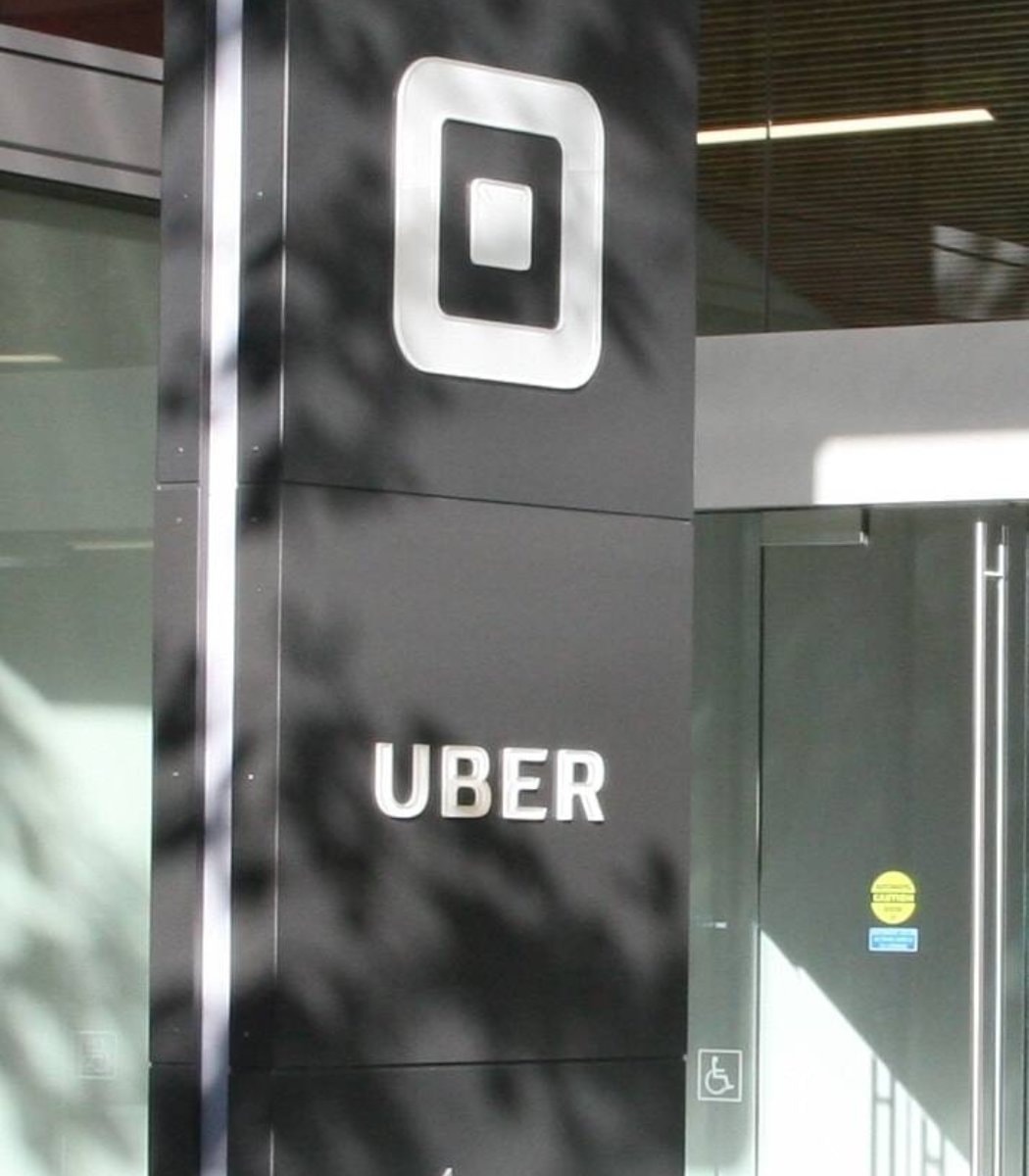 Uber layoffs and autonomous taxi investment
