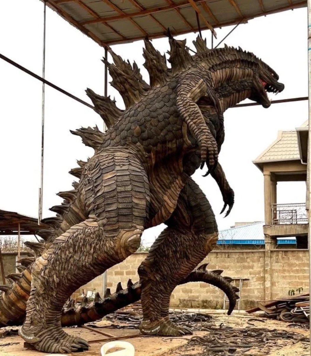 Toyeeb Ajayi Godzilla tire statue (photo 1 of 2)