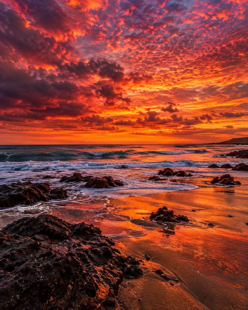 dramatic rocky beach sunset