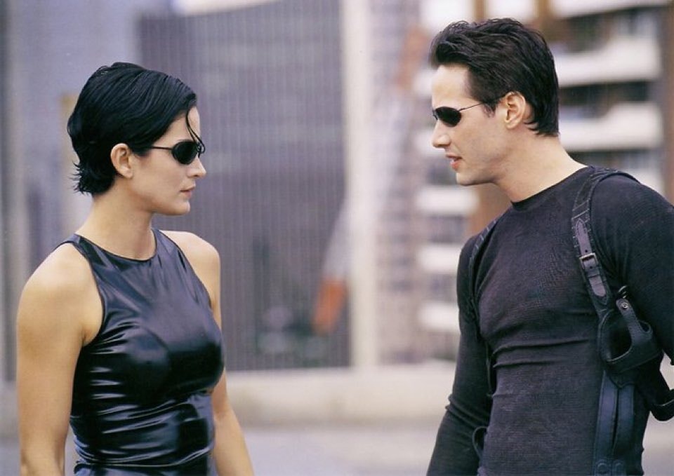 man and woman in sci-fi action film scene