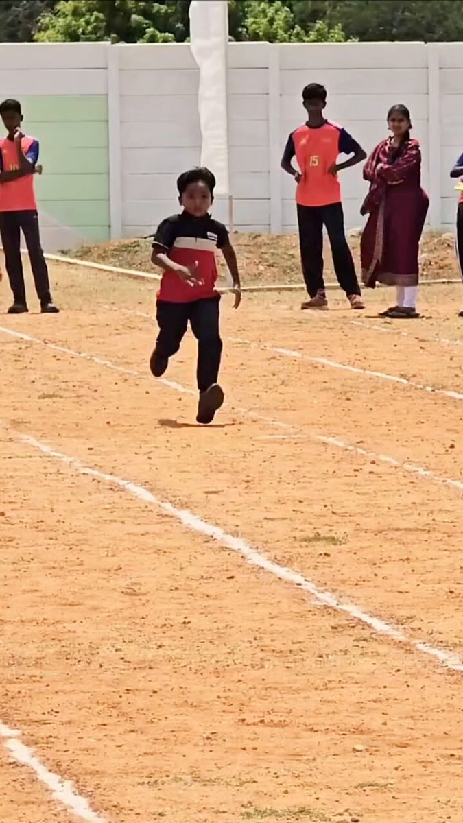 Young boy running race