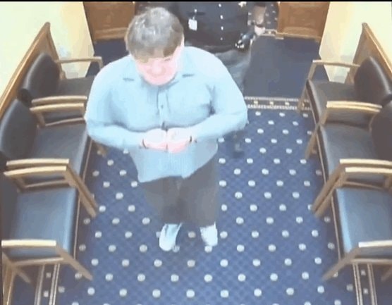 young man in blue shirt holding hands