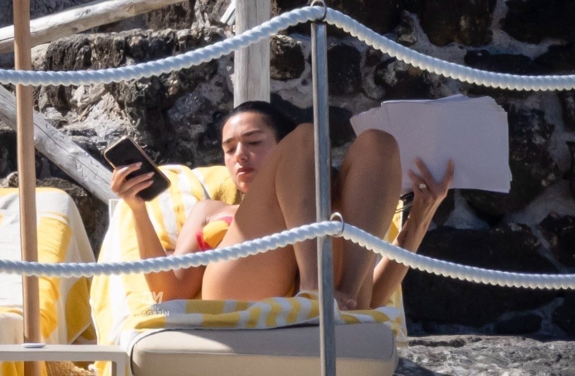 Dua Lipa beach papers (photo 2 of 2)