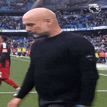 Pep Guardiola walking away