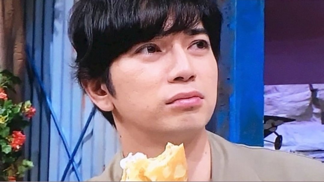 Man holding crepe neutral expression