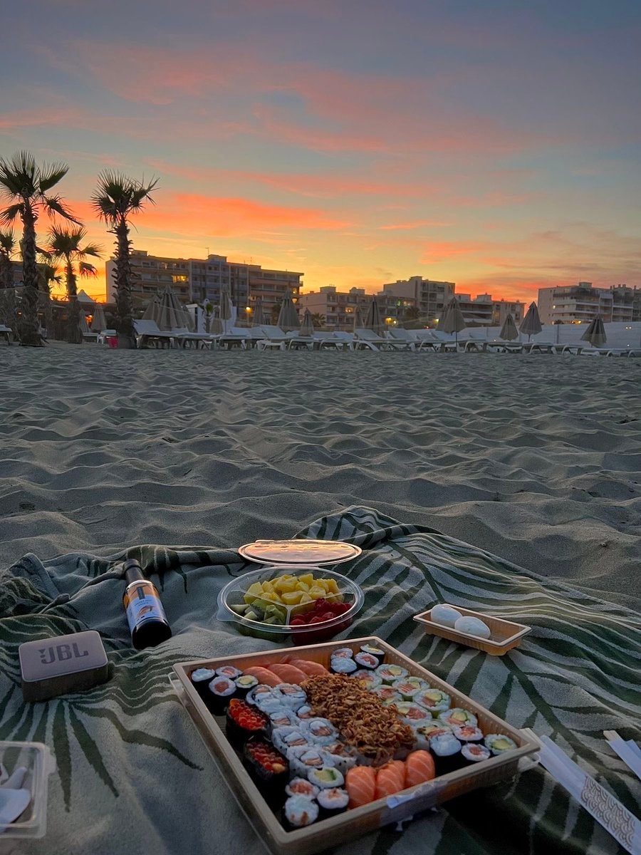 Beach picnic at sunset